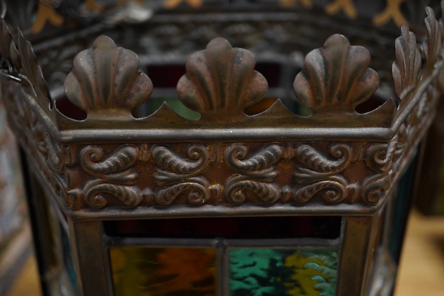 A Victorian coloured stained glass and brass six sided lantern, 31cm high x width 22cm. Condition - glass good, one clip on frame for glass missing